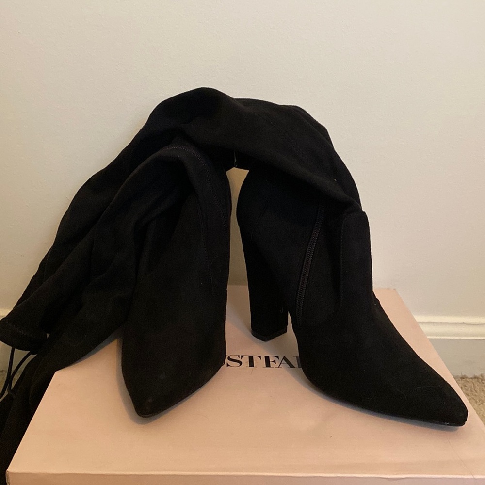 Just Fab thigh-high heeled boot size 9.5. Only worn once.